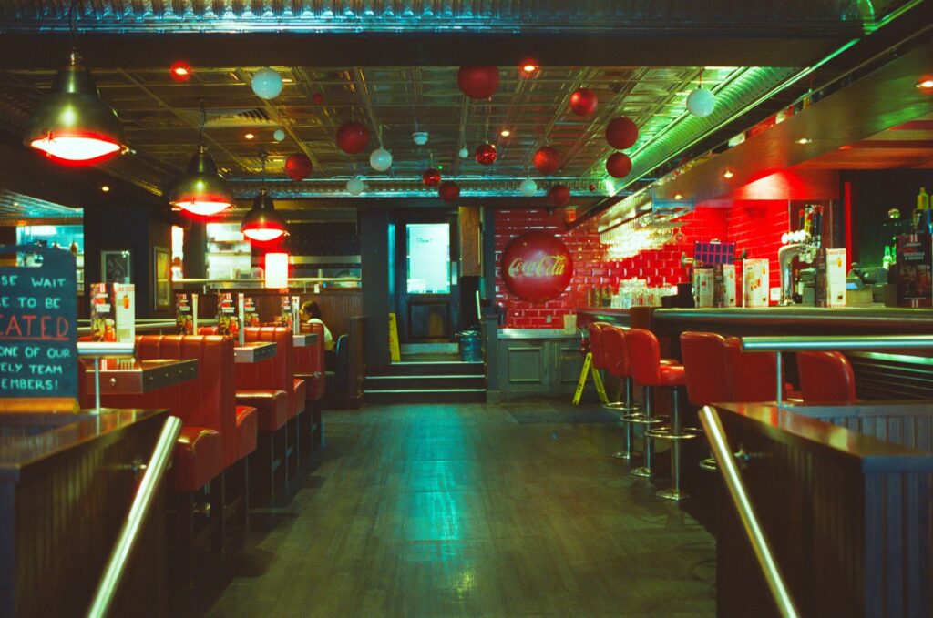 Empty retro diner with red bar stools