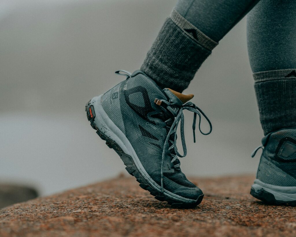 Person in gray nike running shoes